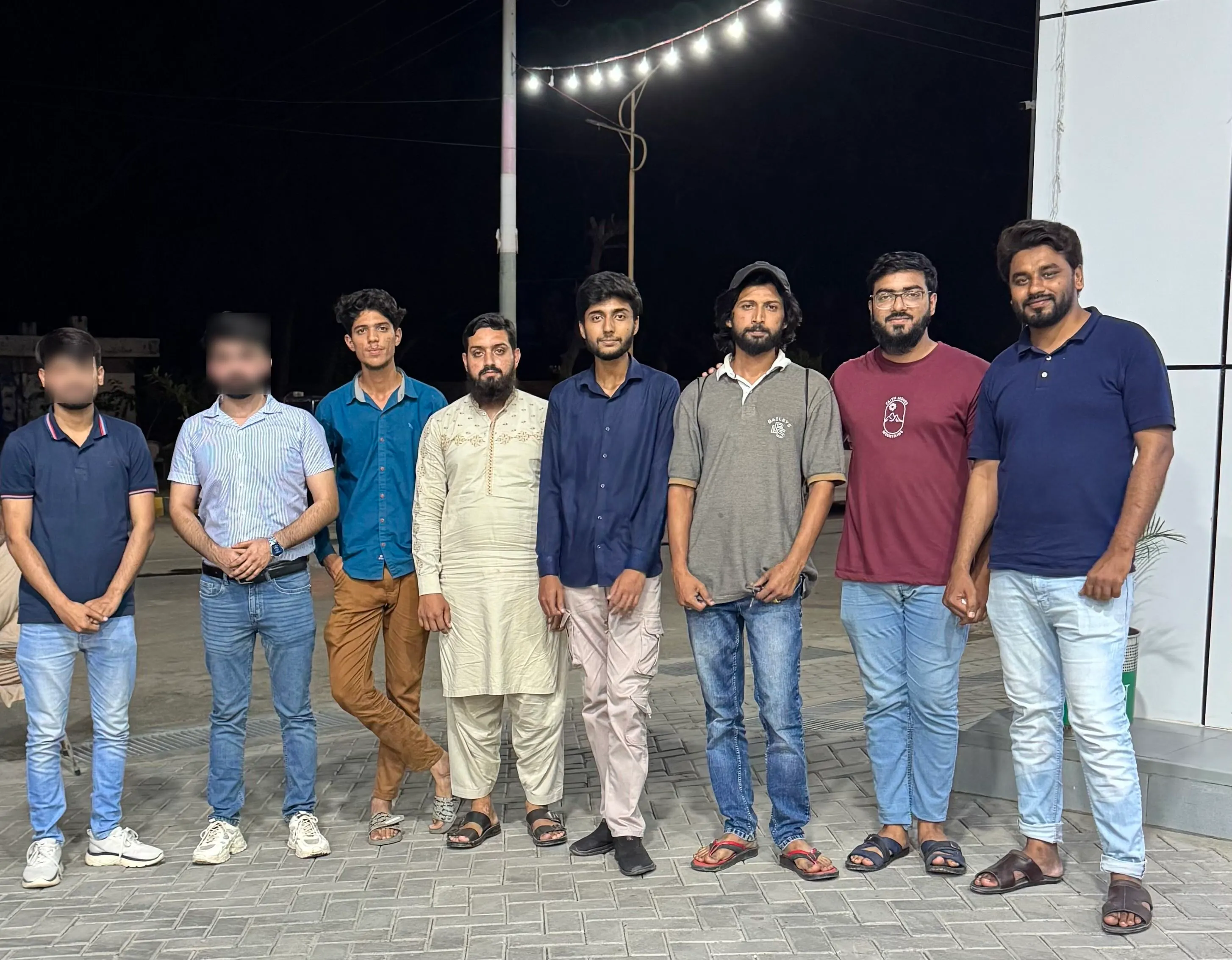Dev Entity team group photo outside the office at night