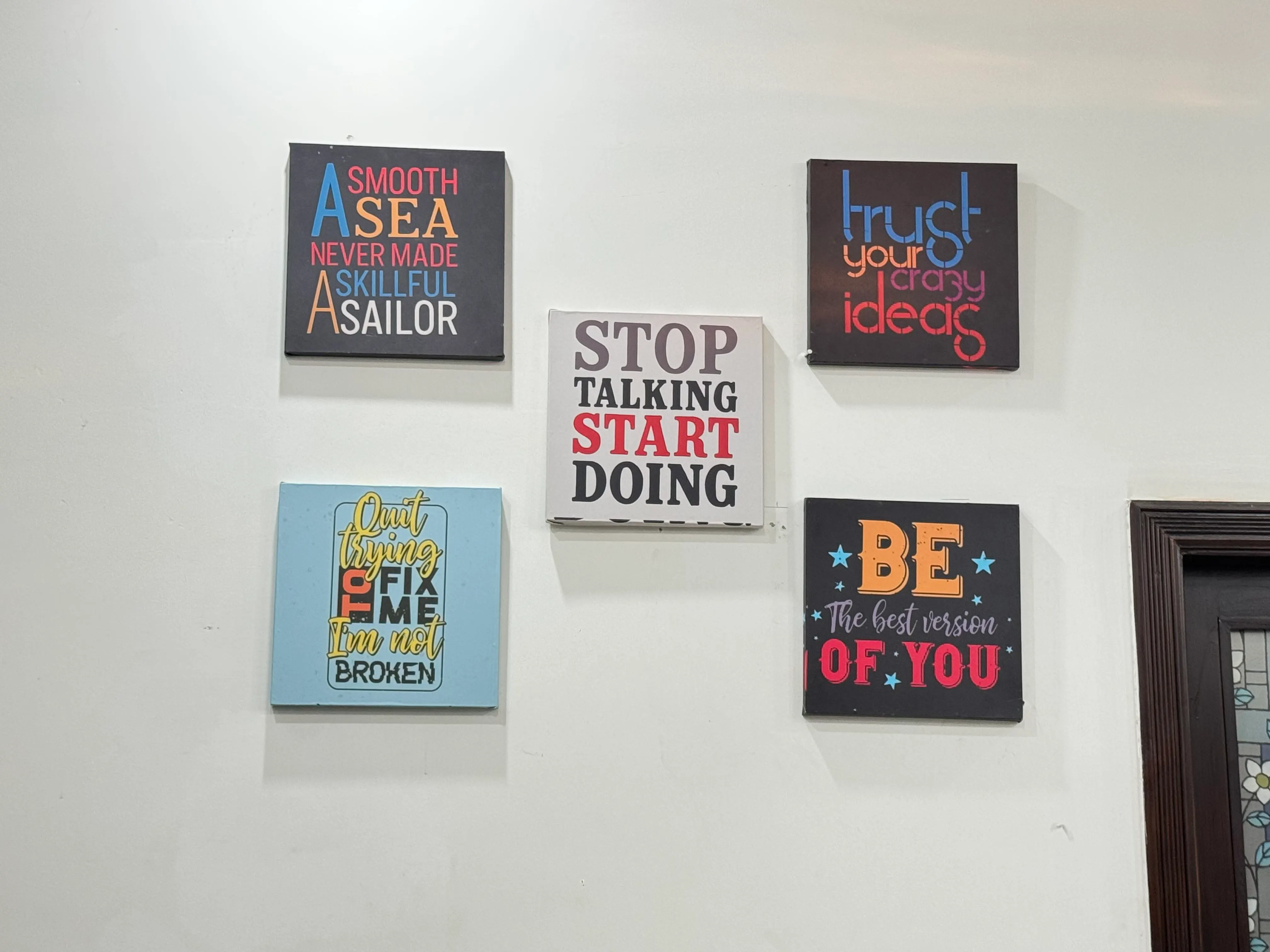 Dev Entity office wall with motivational team posters